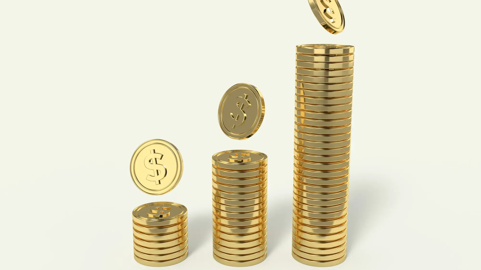Monedas apiladas en columnas de distinta altura